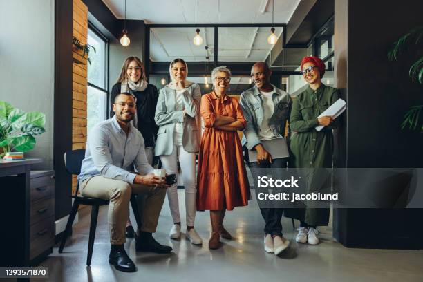 Successful Business Team Smiling At The Camera In An Office Stock Photo - Download Image Now