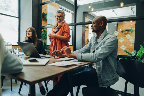 istock Happy businesspeople having a meeting in a creative workplace 1393572992