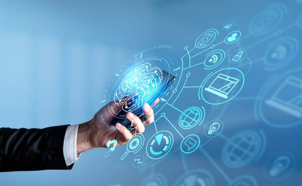 istock Businessman in formal suit is holding smartphone with digital interface 1393574487