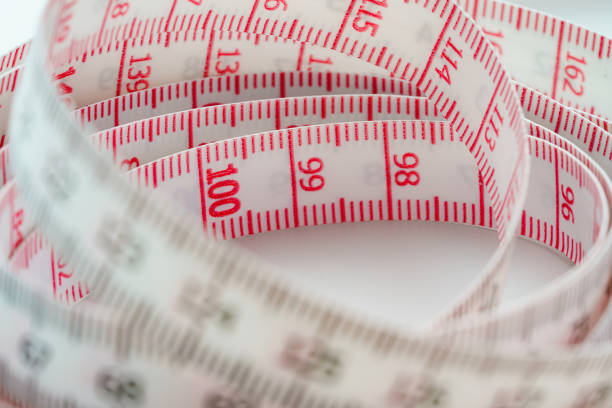 White measuring tape isolated on white background