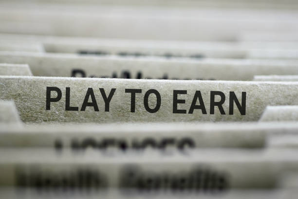 istock File folders with a Play to Earn labeled tab 1393578511