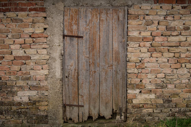 Croatia, April 20,2022: Old wooden rustic doors on rural home wall.