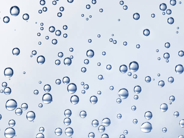 istock Bubbles in water on white background. Closeup Blue tone 1393579061