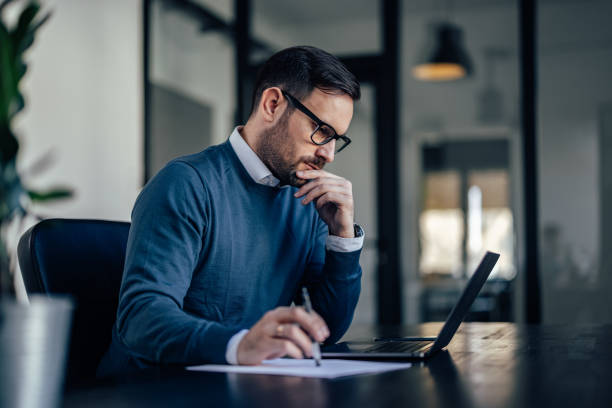 istock Businessman working online from the office, dressed elegantly. 1393580201