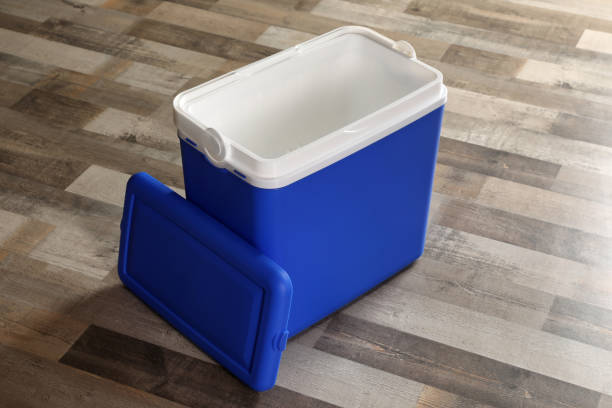 istock Open blue plastic cool box on wooden floor 1393580495