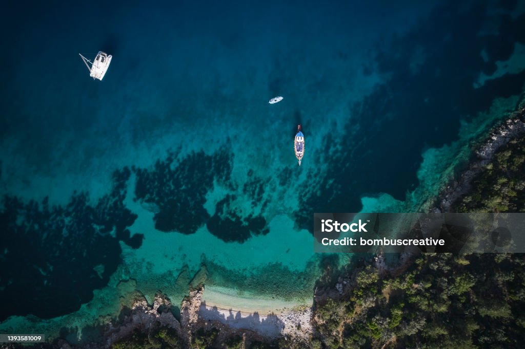Aerial view of clear turquoise sea Aerial view of sandy beach, clear turquoise water Antalya City Stock Photo