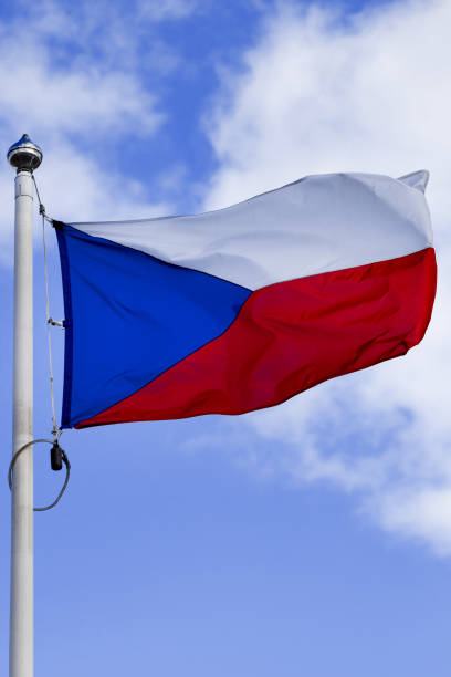 istock Czech flag on the blue sky background. 1393581791