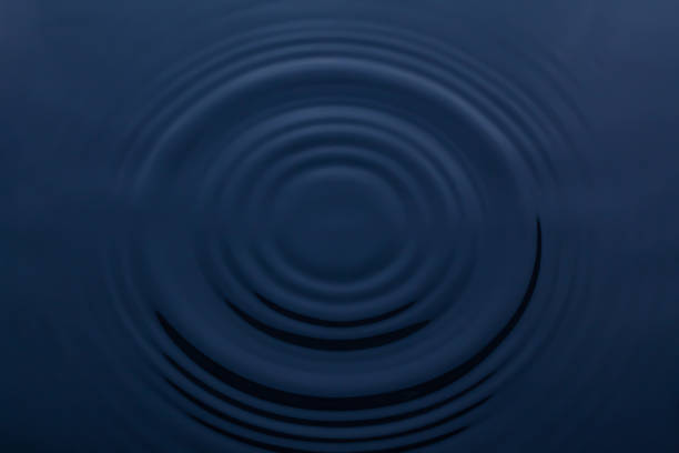 istock Splash and circle of water on a blue background 1393583668