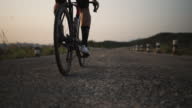 istock Sport man exercise by cycling riding a road bike through the countryside 1393584939