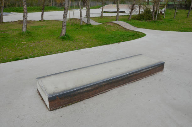 istock Skateboard park with concrete cement surface with concrete skateboard obstacles is designed for roller sports. Cycling is not allowed except for freestyle bikes. Protective clothing, head, elbow knee 1393591512