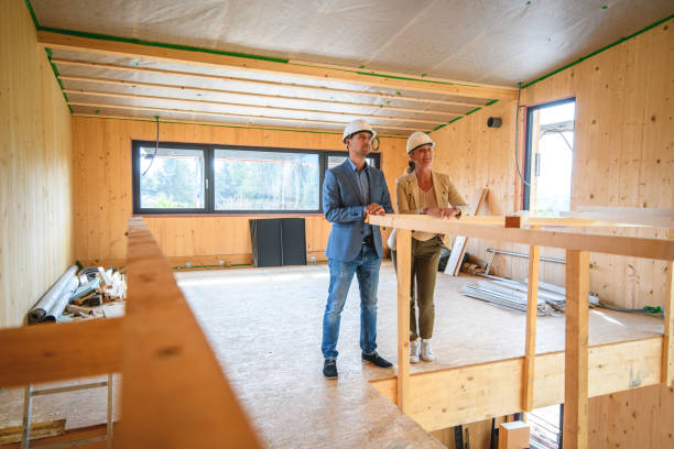 istock Architect And Homeowner Indoors Checking Renovation Project 1393591948