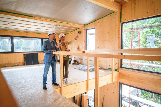 istock Quality Inspectors Working Inside A Wooden House Structure 1393591950