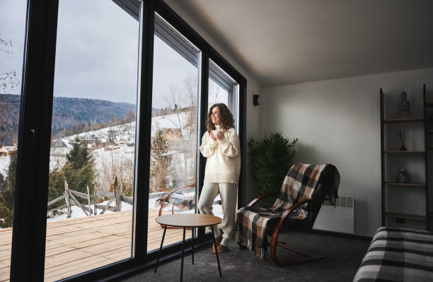 Young woman enjoying weekends inside modern barn house.