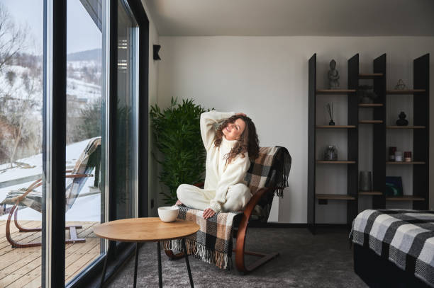 istock Young woman enjoying weekends inside modern barn house. 1393598651