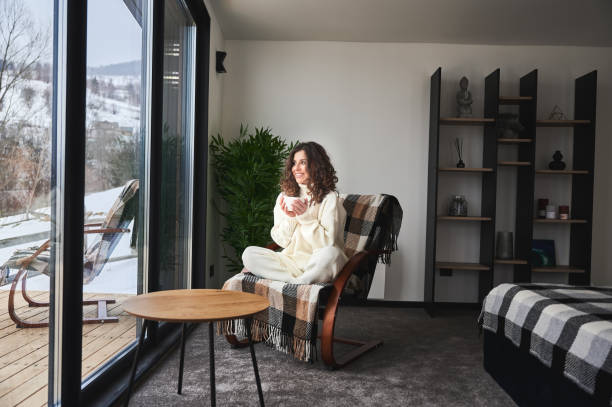 istock Young woman enjoying weekends inside modern barn house. 1393598653