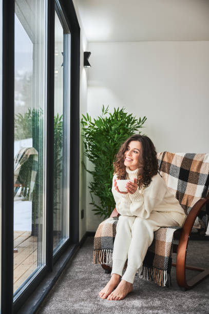 istock Young woman enjoying weekends inside modern barn house. 1393598660