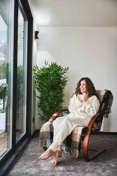 istock Young woman enjoying weekends inside modern barn house. 1393598662
