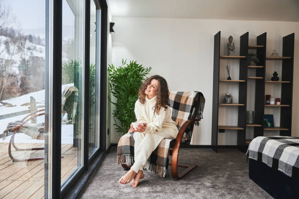 istock Young woman enjoying weekends inside modern barn house. 1393598671