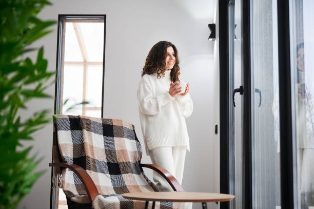 istock Young woman enjoying weekends inside modern barn house. 1393598690