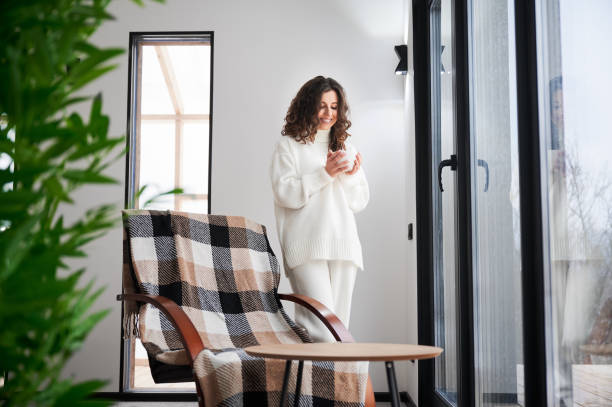 istock Young woman enjoying weekends inside modern barn house. 1393598699