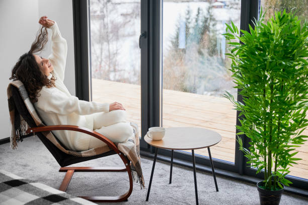 Young woman enjoying weekends inside modern barn house.