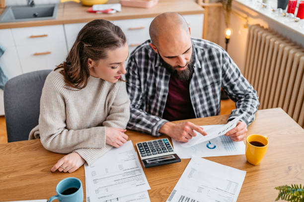 istock Young Couple Discussing Their Finances 1393598855