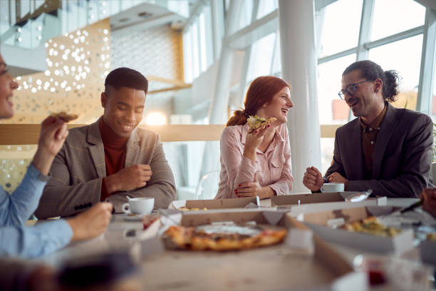 istock Young group of people in restaurant lunch and talks 1393599084