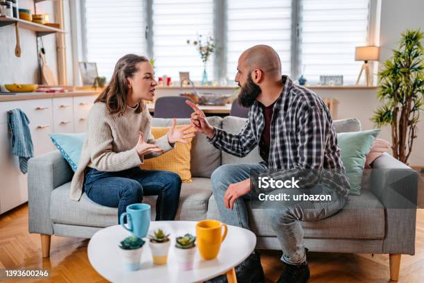Young Couple Arguing At Home Stock Photo - Download Image Now - Arguing, Boyfriend, Girlfriend