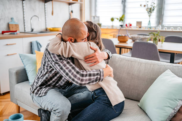 istock Young Couple Hugging On The Sofa 1393600293