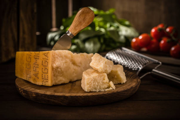 istock Parmesan cheese with a cheese knife on a rustic wooden table 1393602001