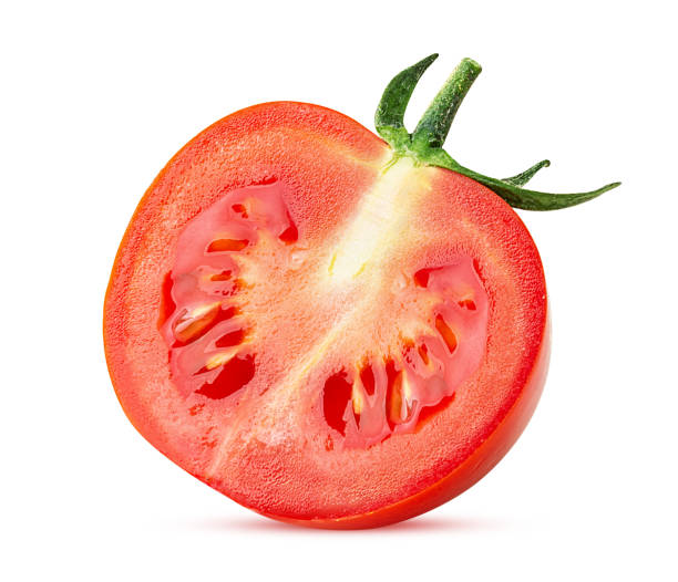 istock Fresh red tomato cut in half with green leaves 1393602403