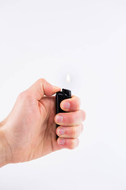 istock gas lighter in hand burns fire on a white background 1393602414