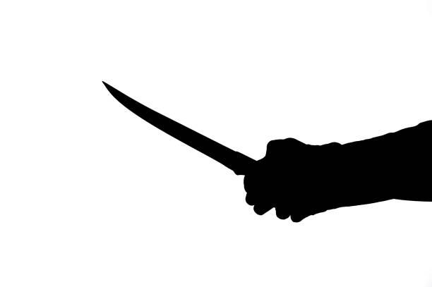 istock dark silhouette of hands with knife 1393603844