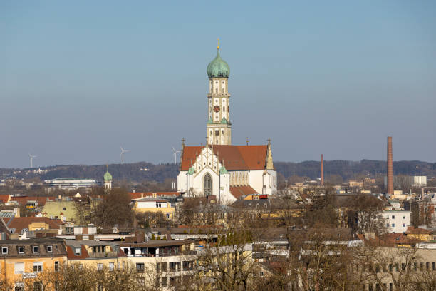 Augsburg, Germany: Mar 22th 2022: Catholic Holy Cross Church in Augsburg, Germany, is a prominent landmark in city skyline.