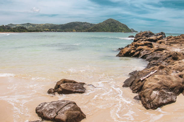 SELONG BELANAK BEACH Best beach in south Lombok, named Selong Belanak. with a scenery landscape around and catching sunset, turquoise sea and water buffalos in the evening lombok indonesia stock pictures, royalty-free photos & images