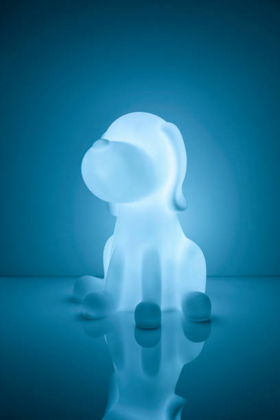 istock Cute lamp in shape of a dog, with light on, isolated 1393610523