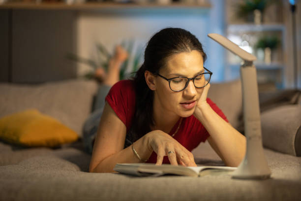 istock Woman reading a book in peace 1393610544
