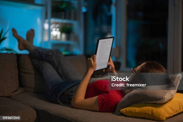 Reading Digital Book Stock Photo - Download Image Now - E-Reader, Reading, Night