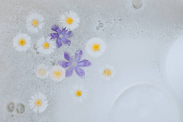 istock Beautiful Periwinkle and Daisy flowers on a bubble background. 1393612577
