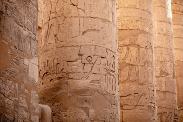 istock Different columns with hieroglyphs in Karnak temple. Karnak temple is the largest complex in ancient Egypt. 1393613109