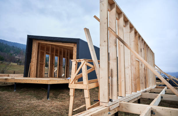 istock Timber frame house on pile foundation under construction in the mountains. 1393613780