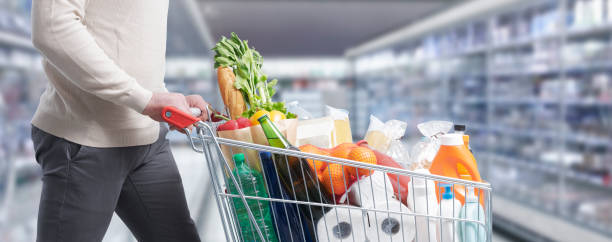 istock Man pushing a trolley at the supermarket 1393615826