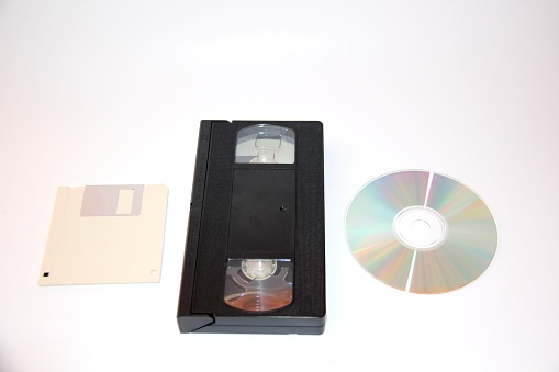 Video tapes, CD, floppy disk .Evolution of technology. On a white background.