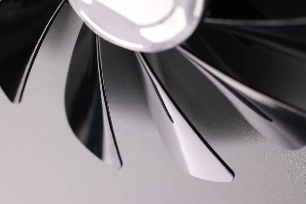 istock Cooling fan with plastic black blades on grey background 1393619546