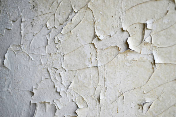 istock White peeling paint on the wall seamless texture. Background 1393620999