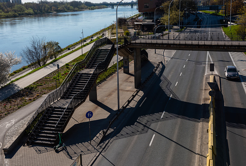 Warsaw, Poland- 04.18.2022: Pedestrian bridge with stairs over the highway.