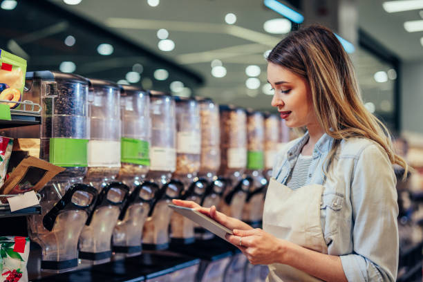 istock Woman working at a grocery store 1393629866
