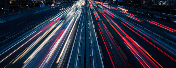 Busy Traffic, Traffic moving in both directions at dusk stock photo