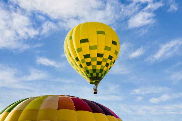 istock Hot air balloon flight over blue sky 1393630324