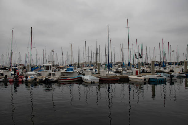 istock boats in the harbor under a gray sky 1393631224